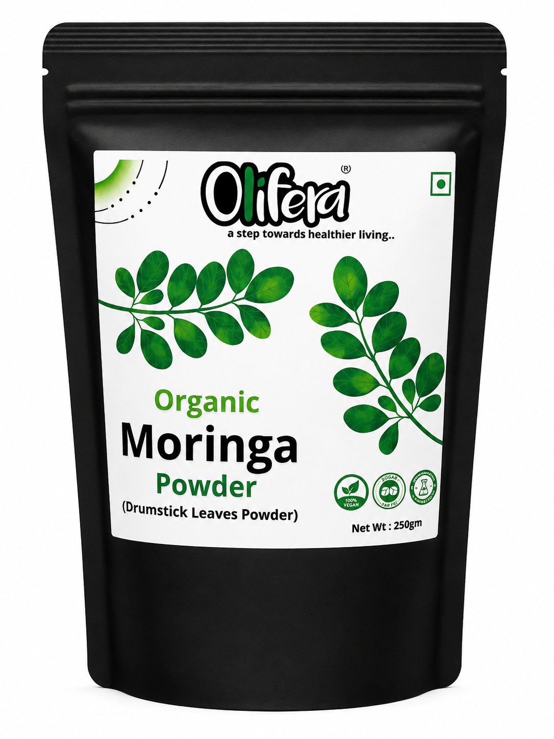 Fine OLIFERA Moringa powder in a wooden bowl with fresh moringa leaves beside it