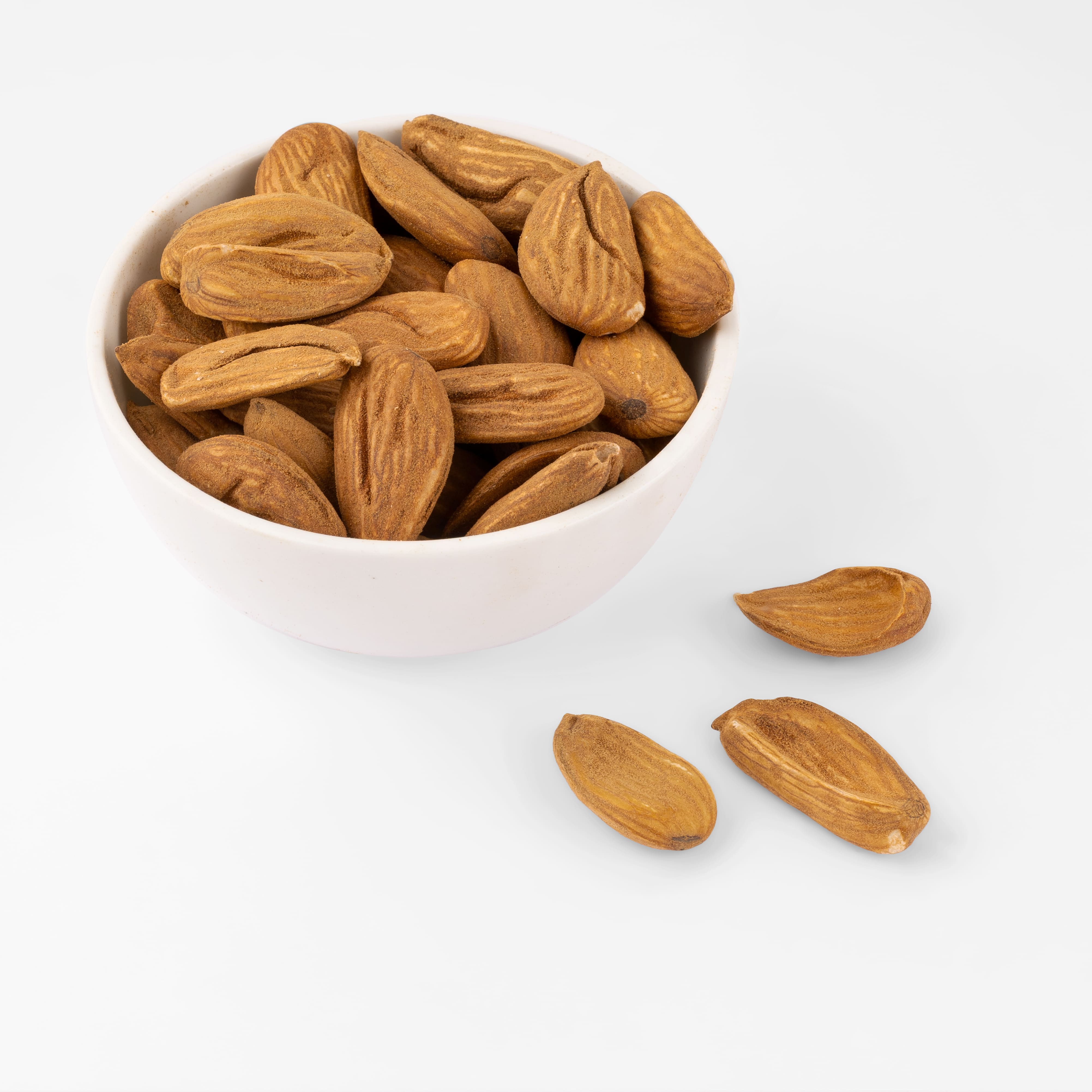 Premium Mamro Badam Mid 3A almonds displayed in a bowl, featuring their natural shape, rich brown colour, crisp texture, and superior freshness.
